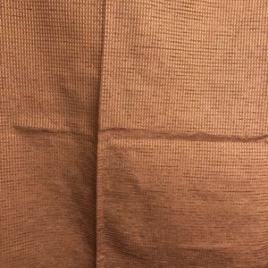 2 textured brown blackout drapes